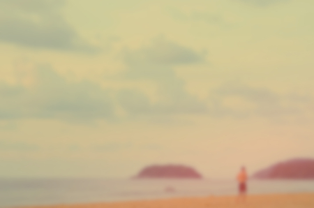 Blur man running on tropical beach abstract background.Retro color style.の写真素材