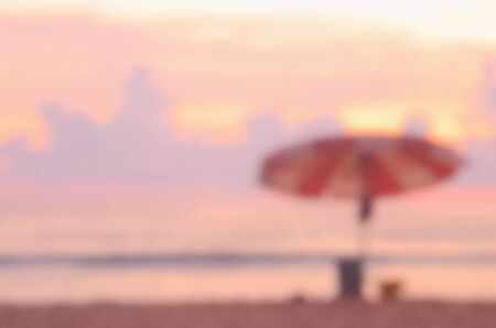Blur umbrella on tropical sunset beach abstract background.Travel concept.の写真素材