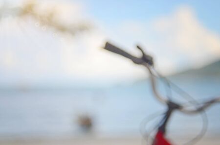 Blurred bicycle on beach abstract background.Travel concept.の写真素材