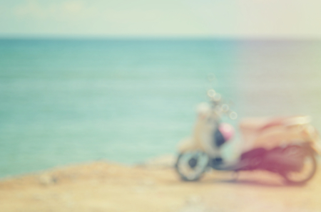 Blur motorcycle on sunset beach abstract background.Travel concept.Vintage color style.の写真素材