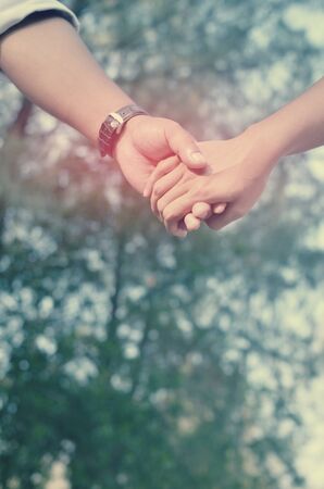 Couple hand holding.Retro color style.の写真素材