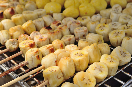 Banana grill and eat with coconut milk.Thailand dessert.の写真素材