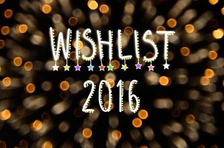 Wishlist 2016 words hand writing on fireworks bokeh color light abstract background.