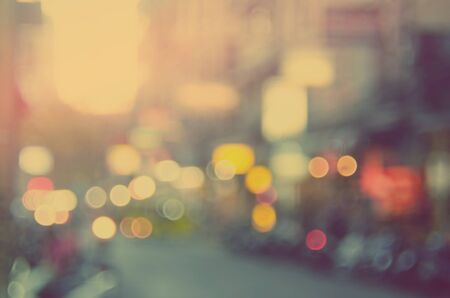 Blur traffic road with bokeh light abstract background. Retro color style.の写真素材