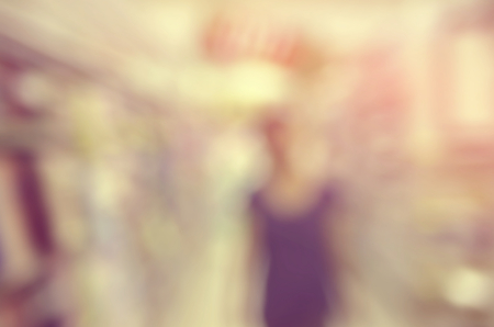 Blur woman shopping in supermarket mall abstract background. Retro color style.の写真素材