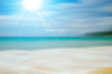 Blur tropical beach with sun light abstract background.Travel concept.