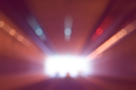 Motion blur exit tunnel traffic road abstract background. Travel and business concept.の写真素材