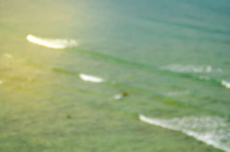 Blur tropical beach with sun light abstract background.Travel concept.の写真素材