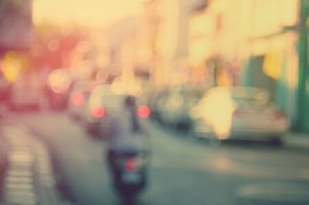 Blur traffic road with bokeh sun light abstract background.Retro color style.の写真素材