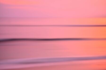 Motion blur tropical sunset beach and smooth wave. Travel concept.の写真素材