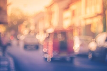 Blur traffic road with old building abstract background. Retro color style.の写真素材