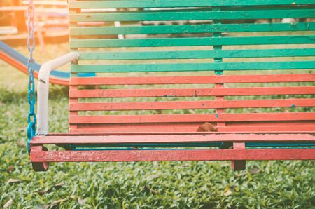 Copy space of swing in outdoor playground. Health care and activity concept. Shallow depth of field....