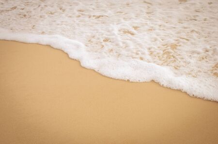 Copy space of smooth wave sunset beach and sand texture background. Summer vacation and business...