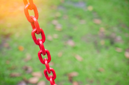 Copy space of iron chain swing in outdoor playground. Health care and activity concept. Shallow depth of field. Vintage tone filter color style.の写真素材