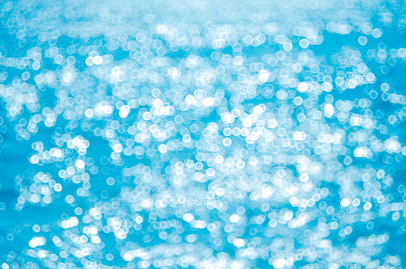 Blur tropical beach with bokeh sun light wave abstract background. Copy space of outdoor summer...