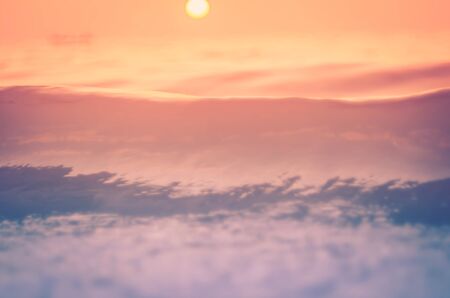 Blur tropical sunset beach with bokeh sun light wave abstract background. Travel concept. Retro color style.の写真素材