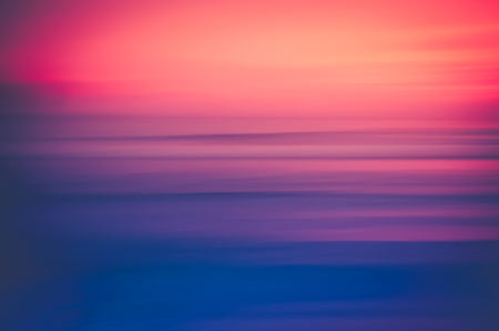 Motion blur colorful tropical sunset beach and smooth wave. Travel concept.