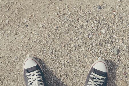 Top view of shoes on tropical sand beach texture background, selfie, copy space of travel adventure...