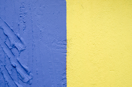 Blue and yellow old stone brick wall texture background. Copy space of horizontal architecture backdrop wallpaper.の写真素材