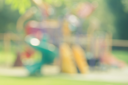 Blur colorful playground in nature green park abstract background. Copy space of sport exercise and health care concept. Vintage tone filter color style.の写真素材
