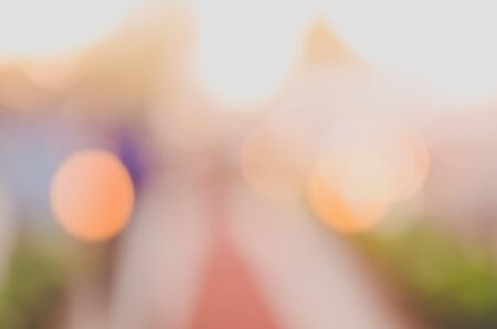 Blur people walking in shopping center mall abstract background. Copy space of business travel concept. Retro tone filter color style.の写真素材