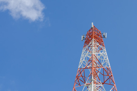 Copy space of telecommunication tower TV and radio antenna signal on blue sky and white cloud...