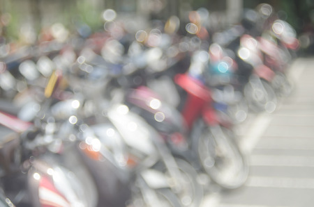 Blur motorcycle park with bokeh sun light abstract background.の写真素材
