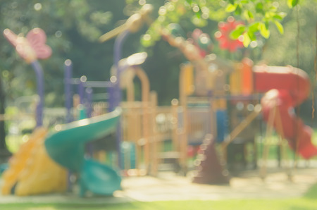 Blur colorful playground in nature green park abstract background. Copy space of sport exercise and health care concept. Vintage tone filter color style.の写真素材