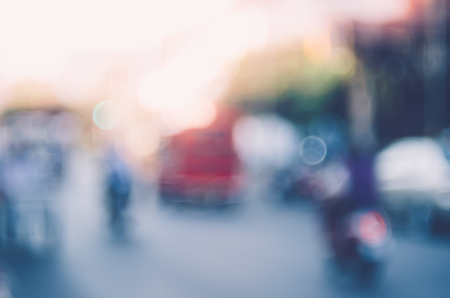 Blur traffic road with colorful bokeh light abstract background. Copy space of transportation and travel concept. Retro tone filter color style.の写真素材
