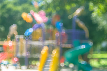 Blur colorful playground in nature green park abstract background. Copy space of sport exercise and health care concept. Vintage tone filter color style.の写真素材