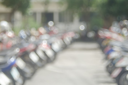 Blur motorcycle park with bokeh sun light abstract background.の写真素材