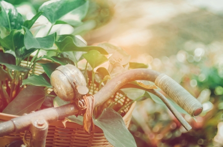 Blur vintage bicycle with flower in basket abstract background. Retro tone filter color style.の写真素材