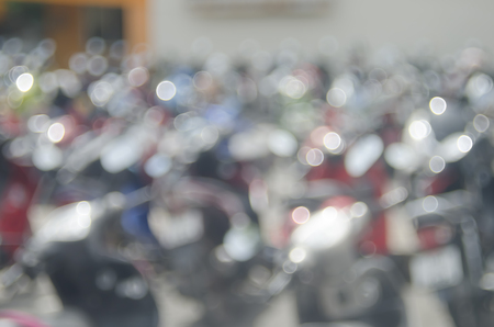 Blur motorcycle park with bokeh sun light abstract background.の写真素材