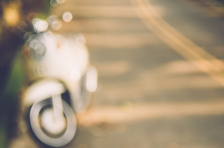 Blur motorbike on road abstract background. Copy space of travel adventure and transport concept. Vintage tone filter color style.の写真素材