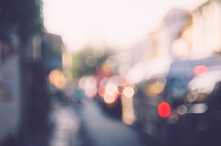 Blur traffic road with colorful bokeh light abstract background. Copy space of transportation and travel concept. Retro tone filter color style.の写真素材