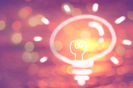 Idea creative thinking in nature and outdoor summer vacation freedom concept.Blur tropical sunset beach bokeh wave double exposure light bulb texture background.の写真素材