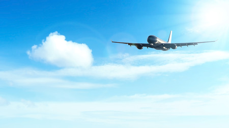 Copy space of airplane on blue sky and white cloud with sun light background. Business travel...