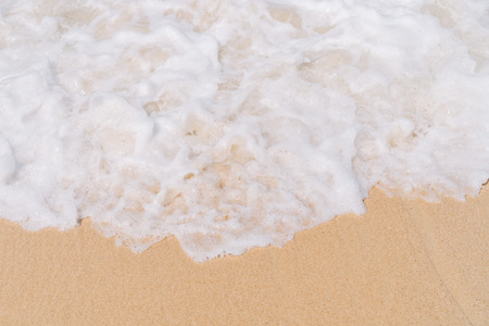 Copy space smooth wave beach with sand texture abstract background. Summer vacation and business travel relax concept.の写真素材