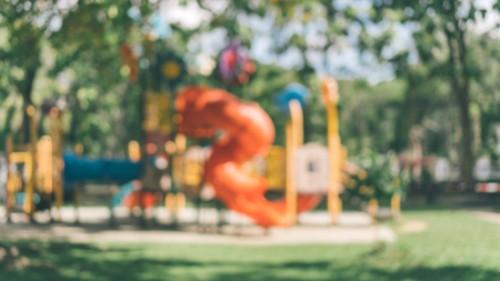 Blur colorful playground in nature green park abstract background. Copy space of sport exercise and health care concept. Vintage tone filter effect color style.の写真素材