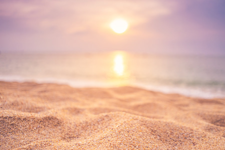Copy space of soft sand sea and blur tropical beach with sunset sky and cloud abstract background. Summer vacation adventure and holiday travel freedom concept. Vintage tone filter effect color style.の写真素材