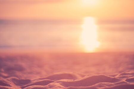 Copy space of soft sand sea and blur tropical beach with sunset sky and cloud abstract background. Summer vacation adventure and holiday travel freedom concept. Vintage tone filter effect color style.の写真素材