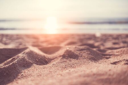 Copy space of soft sand sea and blur tropical beach with sunset sky and cloud abstract background....