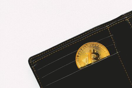 Bitcoin in wallet. Technology business concept.の写真素材