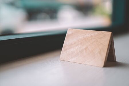 Empty small wooden on table in coffee shop. Vintage tone color style.の写真素材
