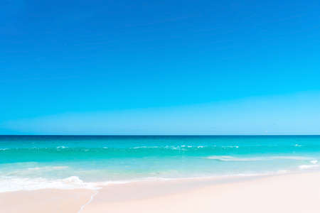 Beautiful tropical beach with blue sky and white clouds abstract texture background. Copy space of summer vacation and holiday business travel concept. Vintage tone filter effect color style.の写真素材