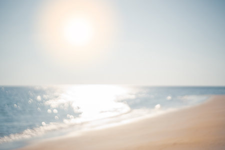 Copy space blur tropical beach with bokeh sun light wave on blue sky and white cloud abstract background. Summer vacation outdoor and travel holiday adventure concept. Vintage tone filter effect color.の写真素材