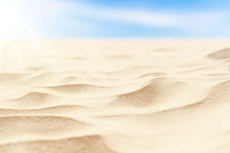 Copy space blur tropical beach with bokeh sun light wave on blue sky and white cloud abstract background. Summer vacation outdoor and travel holiday adventure concept. Vintage tone filter effect color.の写真素材