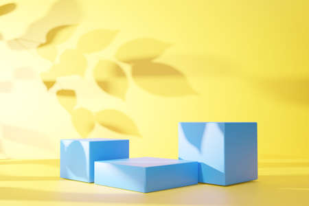 Blue podium and leaf shadow on yellow abstract background. 3D render graphic design.の写真素材