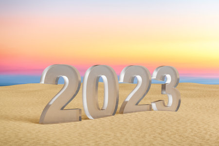 2023 glass number on sand sunset beach. Happy new year and holiday concept.