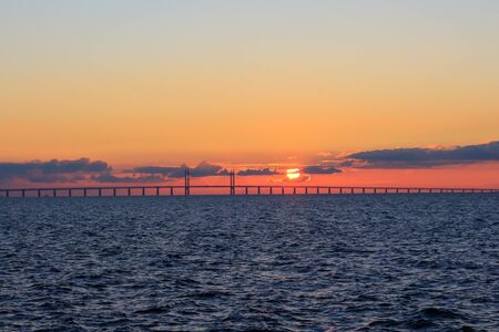Oresunds bridge at sunset from the swedish side over to Denmark.の写真素材